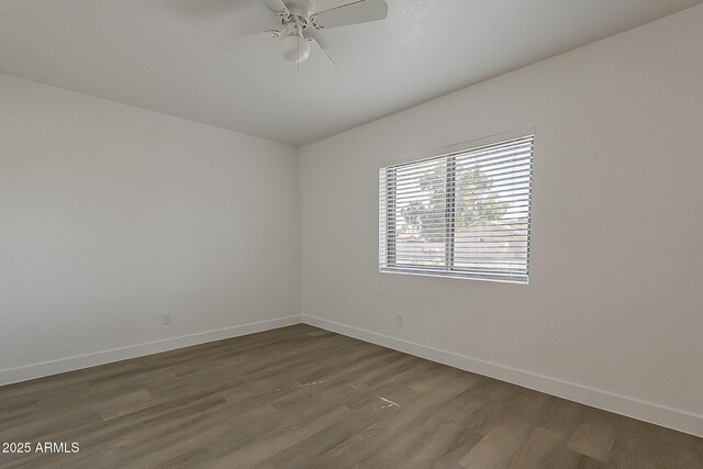 16421 N 34th Ave, Phoenix, AZ 85053 - empty room featuring dark wood-style flooring, ceiling fan, and vaulted ceiling
