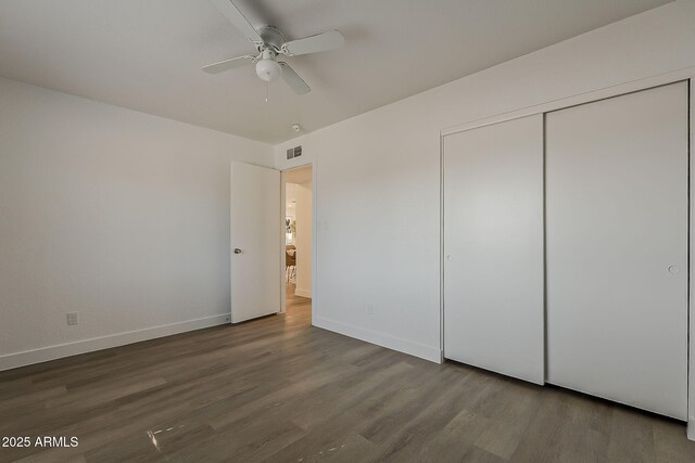 16421 N 34th Ave, Phoenix, AZ 85053 - unfurnished bedroom with wood finished floors, a closet, and a ceiling fan