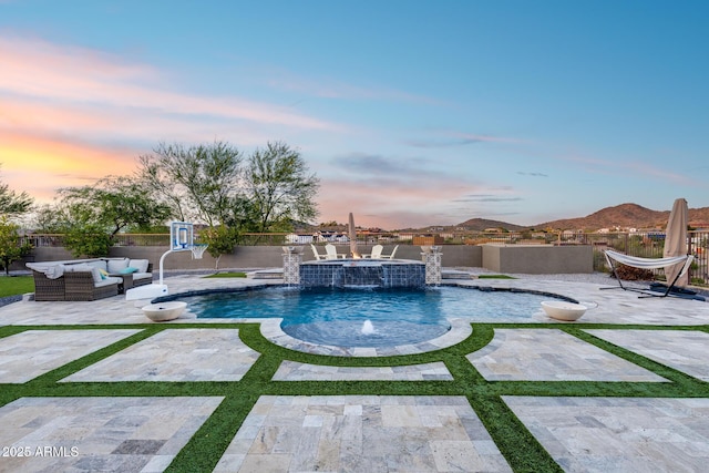 9527 W Whitehorn Way, Peoria, AZ 85383 - pool at dusk with outdoor lounge area, a fenced backyard, a patio area, and a pool with connected hot tub
