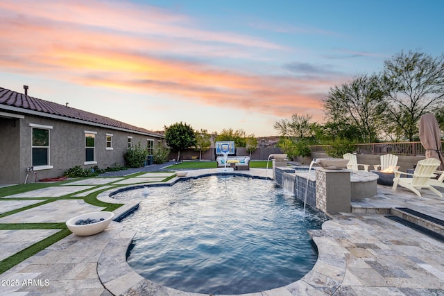 9527 W Whitehorn Way, Peoria, AZ 85383 - pool at dusk featuring an outdoor fire pit and a patio area