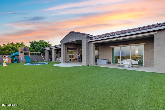 9527 W Whitehorn Way, Peoria, AZ 85383 - rear view of house featuring a patio, a playground, and stucco siding