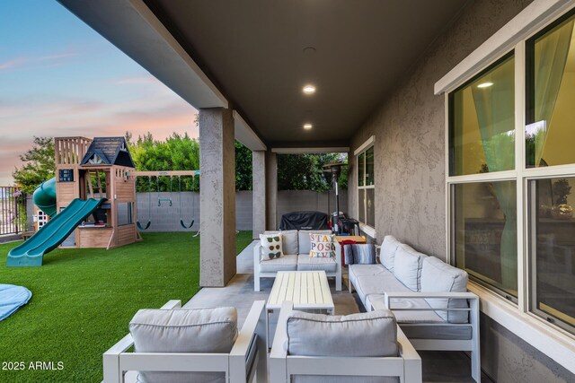 9527 W Whitehorn Way, Peoria, AZ 85383 - patio terrace at dusk with outdoor lounge area and a playground