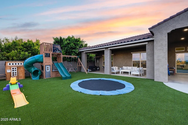 9527 W Whitehorn Way, Peoria, AZ 85383 - playground at dusk with an outdoor living space, a yard, a playground, and a patio