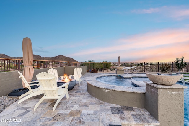 9527 W Whitehorn Way, Peoria, AZ 85383 - patio terrace at dusk with an outdoor fire pit and a patio