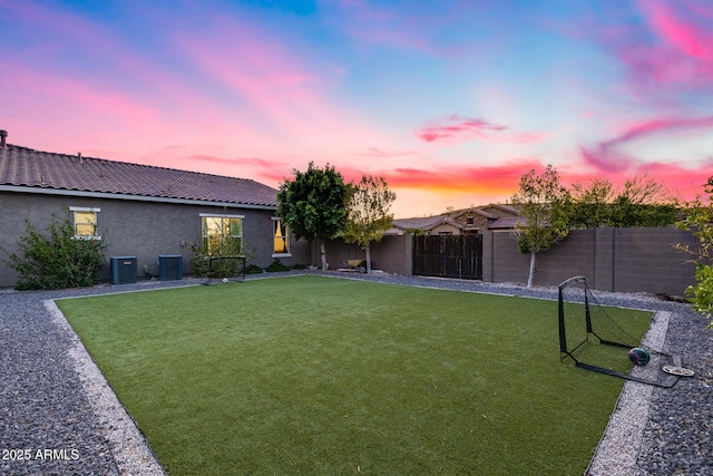 9527 W Whitehorn Way, Peoria, AZ 85383 - yard at dusk featuring central AC