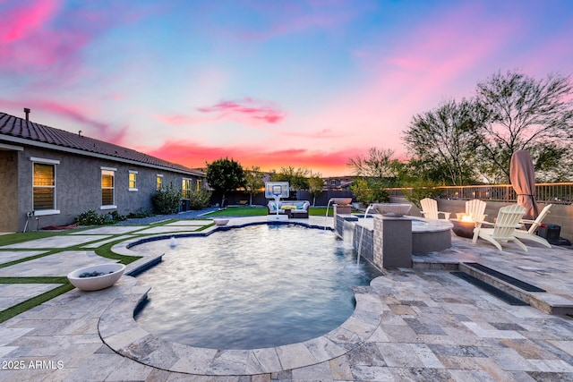 9527 W Whitehorn Way, Peoria, AZ 85383 - pool at dusk with an outdoor fire pit and a patio