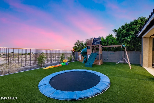 9527 W Whitehorn Way, Peoria, AZ 85383 - playground at dusk featuring a playground and a trampoline