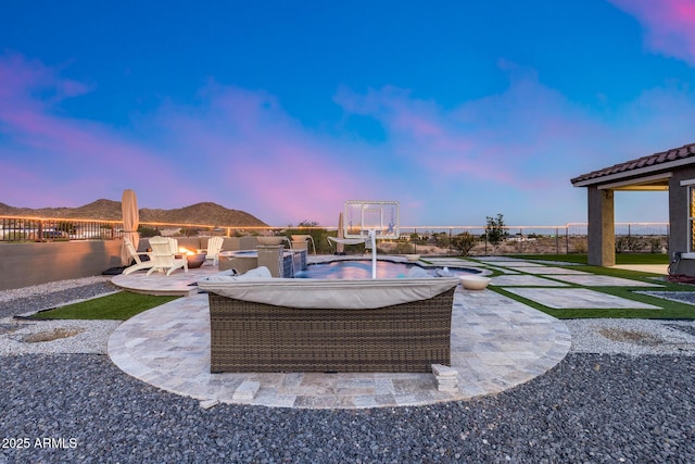 9527 W Whitehorn Way, Peoria, AZ 85383 - patio terrace at dusk featuring a patio area and a fenced backyard