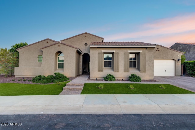9527 W Whitehorn Way, Peoria, AZ 85383 - mediterranean / spanish house featuring stucco siding, a garage, a tiled roof, and a front yard