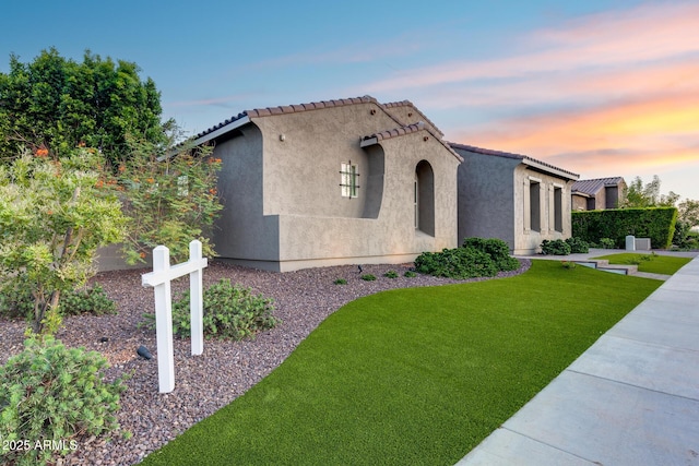 9527 W Whitehorn Way, Peoria, AZ 85383 - mediterranean / spanish home featuring stucco siding, a front lawn, and a tile roof