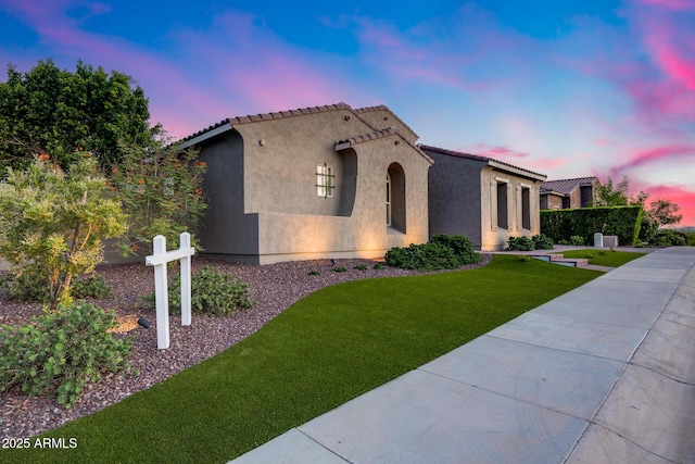 9527 W Whitehorn Way, Peoria, AZ 85383 - mediterranean / spanish-style home featuring stucco siding, a tile roof, and a front yard
