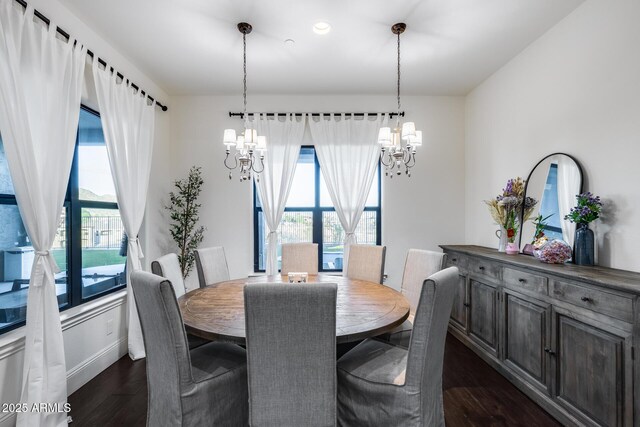 9527 W Whitehorn Way, Peoria, AZ 85383 - dining area featuring a chandelier, dark wood-type flooring, and healthy amount of natural light