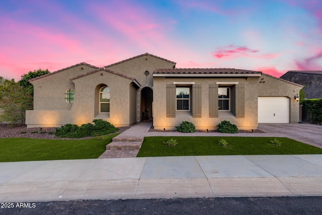 9527 W Whitehorn Way, Peoria, AZ 85383 - mediterranean / spanish home with a garage, stucco siding, concrete driveway, and a yard
