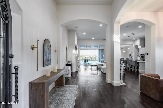 9527 W Whitehorn Way, Peoria, AZ 85383 - foyer featuring dark wood-type flooring, recessed lighting, arched walkways, and baseboards