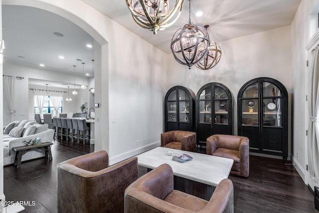 9527 W Whitehorn Way, Peoria, AZ 85383 - living area featuring a chandelier, arched walkways, dark wood-type flooring, and recessed lighting