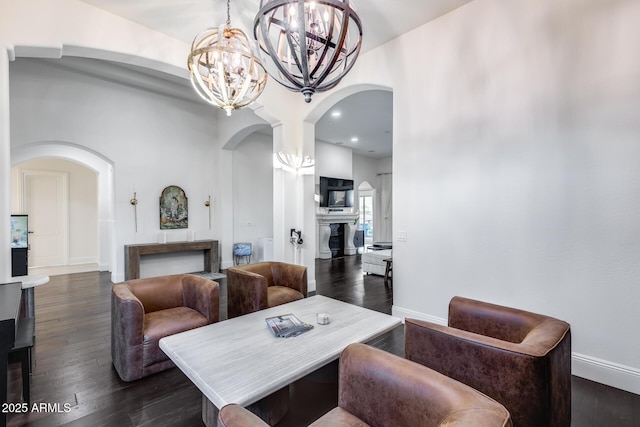 9527 W Whitehorn Way, Peoria, AZ 85383 - living room featuring arched walkways, a chandelier, dark wood finished floors, and recessed lighting