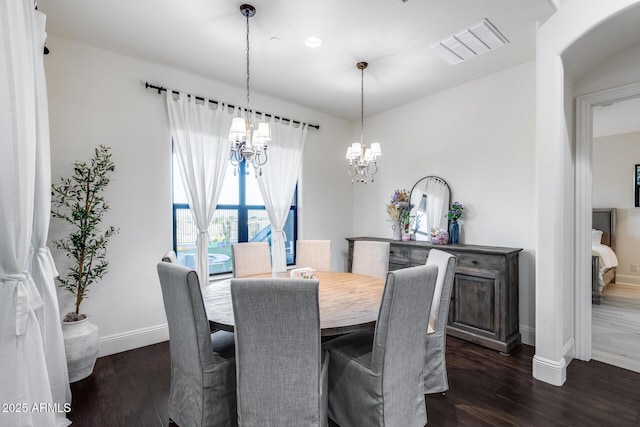 9527 W Whitehorn Way, Peoria, AZ 85383 - dining area with a chandelier, dark wood-style flooring, and baseboards