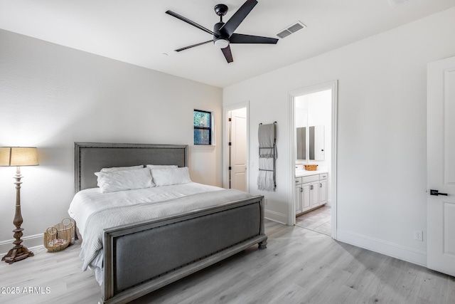 9527 W Whitehorn Way, Peoria, AZ 85383 - bedroom featuring light wood-style flooring, baseboards, connected bathroom, and a ceiling fan
