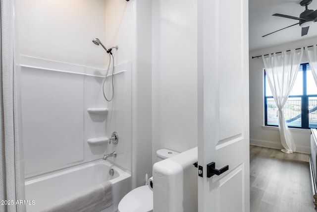 9527 W Whitehorn Way, Peoria, AZ 85383 - bathroom featuring  shower combination, a ceiling fan, toilet, and wood finished floors