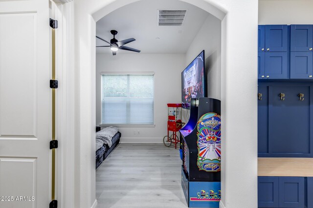 9527 W Whitehorn Way, Peoria, AZ 85383 - bedroom featuring arched walkways, light wood-style flooring, and baseboards