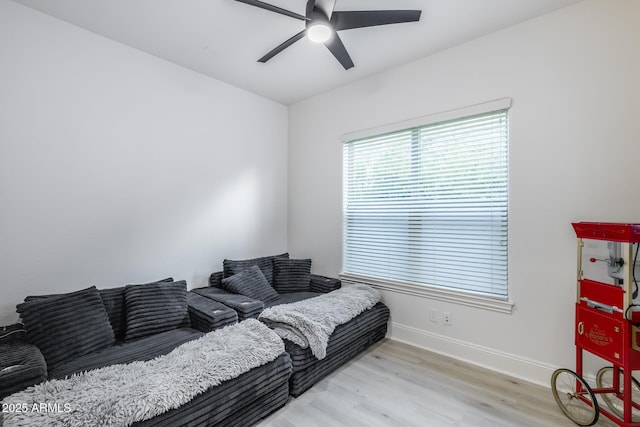 9527 W Whitehorn Way, Peoria, AZ 85383 - living room featuring a ceiling fan, light wood-style floors, and baseboards