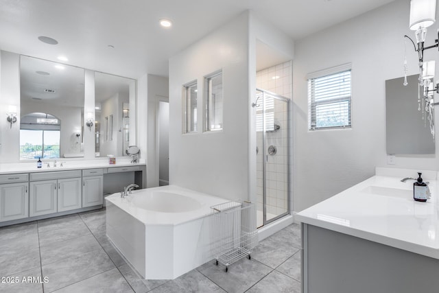 9527 W Whitehorn Way, Peoria, AZ 85383 - full bathroom with a bath, two vanities, a stall shower, healthy amount of natural light, and recessed lighting