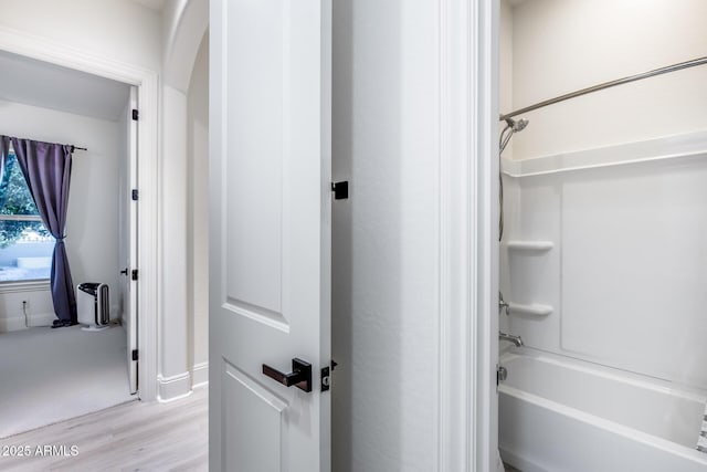 9527 W Whitehorn Way, Peoria, AZ 85383 - bathroom with wood finished floors, baseboards, and bathtub / shower combination