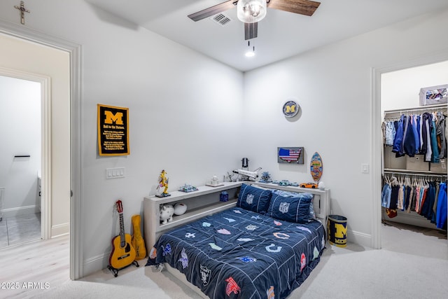 9527 W Whitehorn Way, Peoria, AZ 85383 - bedroom featuring a closet, baseboards, a ceiling fan, and a walk in closet