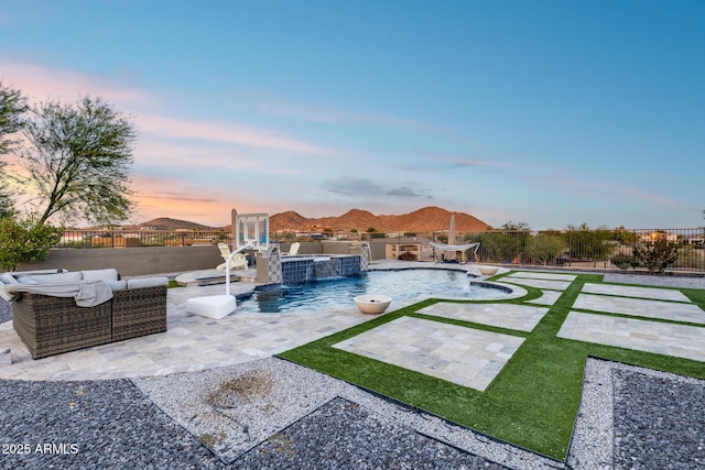 9527 W Whitehorn Way, Peoria, AZ 85383 - pool at dusk with a fenced backyard, a patio, area for grilling, outdoor lounge area, and a pool with connected hot tub