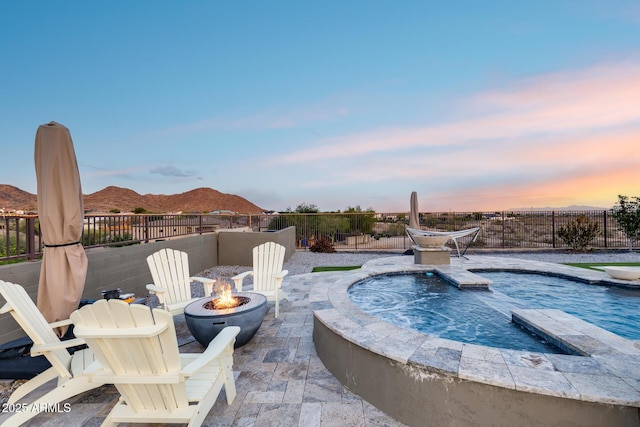 9527 W Whitehorn Way, Peoria, AZ 85383 - view of pool with a fire pit, a mountain view, a patio, and a pool with connected hot tub
