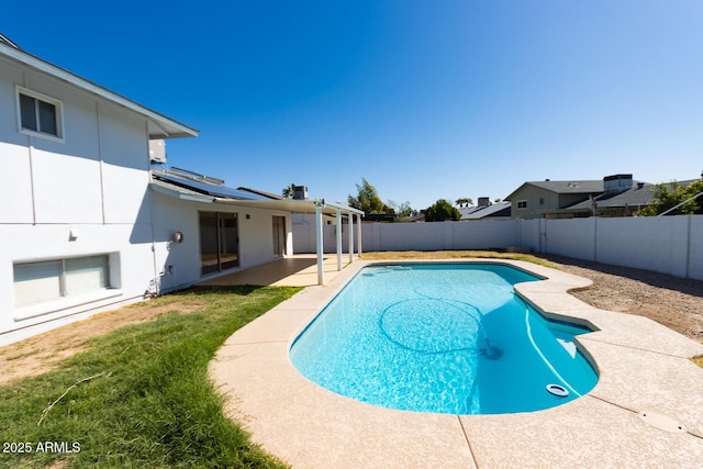 view of pool with a patio area, a fenced backyard, a fenced in pool, and a lawn