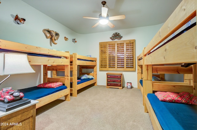 bedroom featuring ceiling fan and light carpet