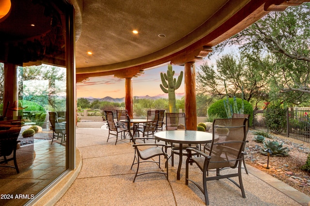 view of patio terrace at dusk