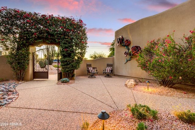 view of patio terrace at dusk