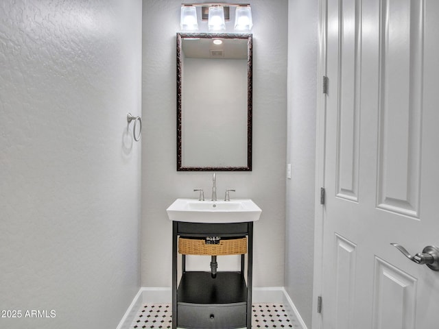 3809 E Lynx Pl, Chandler, AZ 85249 - bathroom with baseboards and a sink