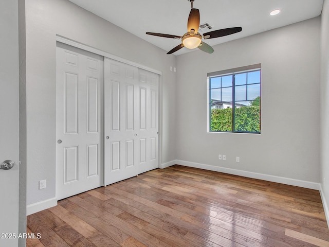 3809 E Lynx Pl, Chandler, AZ 85249 - unfurnished bedroom with baseboards, wood-type flooring, a closet, and recessed lighting
