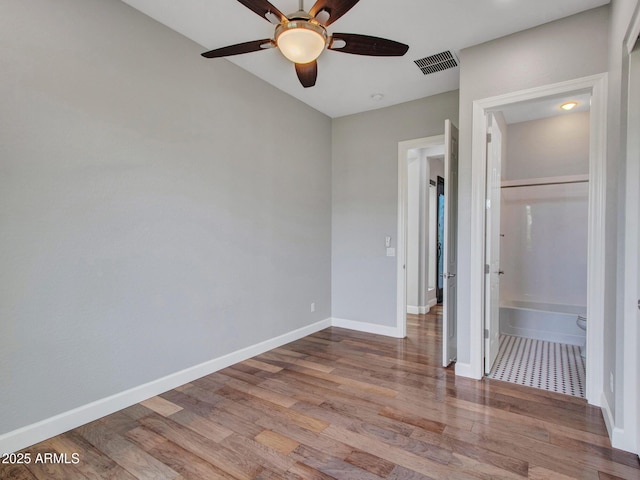 3809 E Lynx Pl, Chandler, AZ 85249 - unfurnished bedroom with wood finished floors, baseboards, and ceiling fan