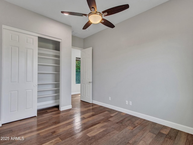 3809 E Lynx Pl, Chandler, AZ 85249 - unfurnished bedroom with a closet, baseboards, wood finished floors, and a ceiling fan