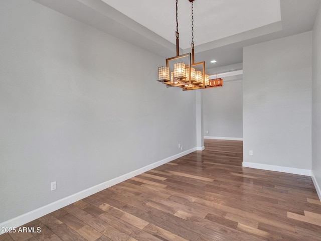 3809 E Lynx Pl, Chandler, AZ 85249 - spare room featuring a chandelier, baseboards, wood finished floors, and recessed lighting