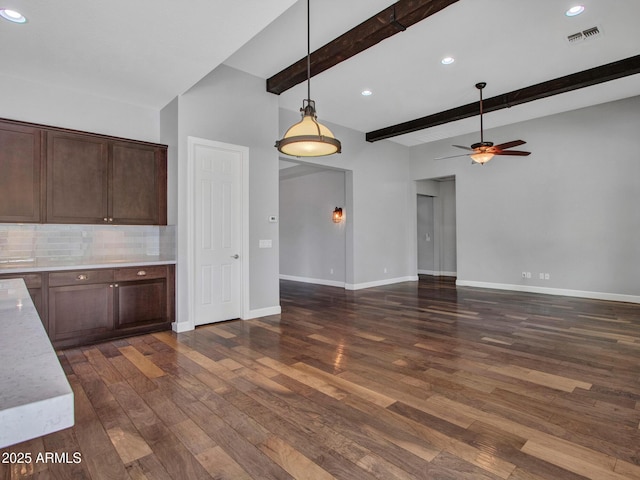 3809 E Lynx Pl, Chandler, AZ 85249 - kitchen with light countertops, a ceiling fan, dark wood-type flooring, decorative backsplash, and beam ceiling