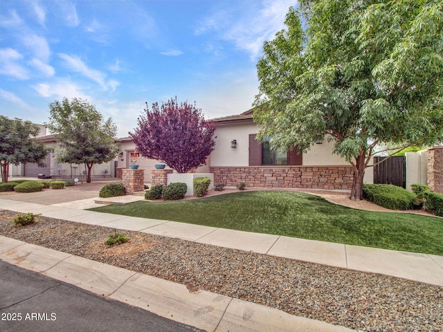 3809 E Lynx Pl, Chandler, AZ 85249 - view of property hidden behind natural elements featuring stucco siding, stone siding, and driveway
