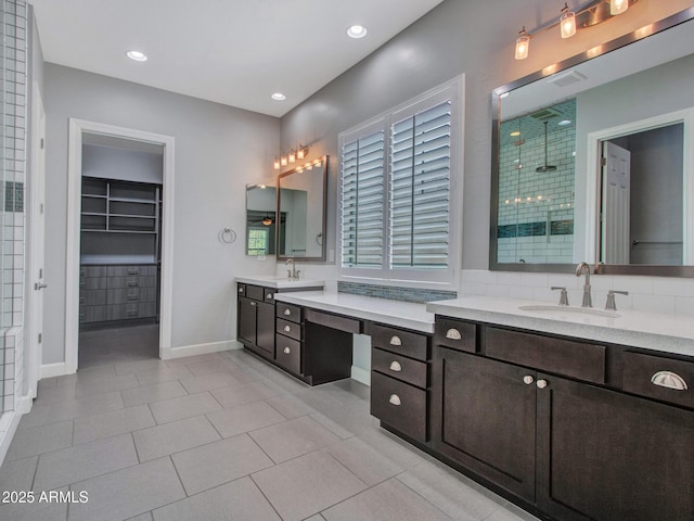 3809 E Lynx Pl, Chandler, AZ 85249 - full bathroom with a stall shower, vanity, baseboards, a walk in closet, and tile patterned floors