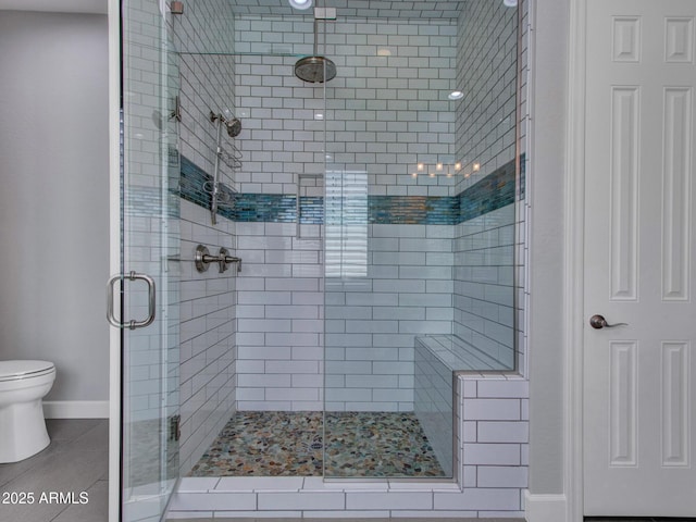 3809 E Lynx Pl, Chandler, AZ 85249 - full bath with a stall shower, toilet, tile patterned floors, and baseboards