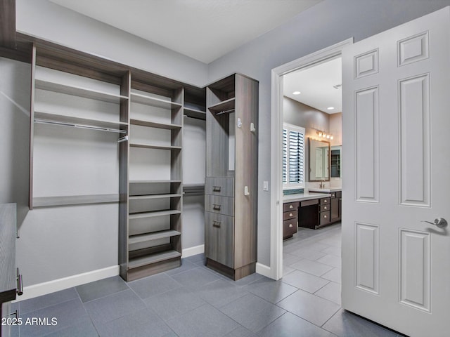 3809 E Lynx Pl, Chandler, AZ 85249 - spacious closet featuring dark tile patterned floors and a sink