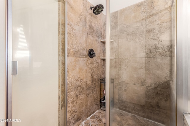 room details featuring a shower with shower door