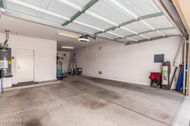 garage with a garage door opener and water heater