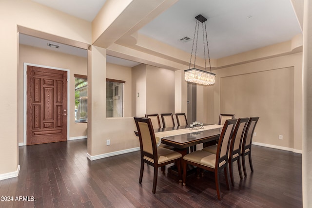 dining space with dark hardwood / wood-style flooring