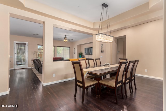 dining room with dark hardwood / wood-style floors and ceiling fan