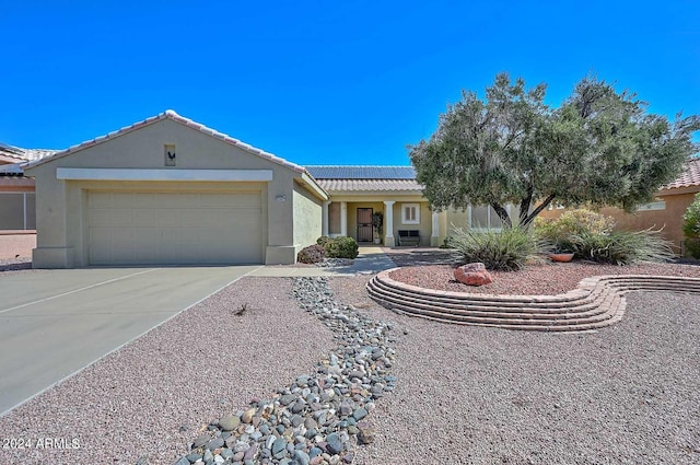 ranch-style home with a garage