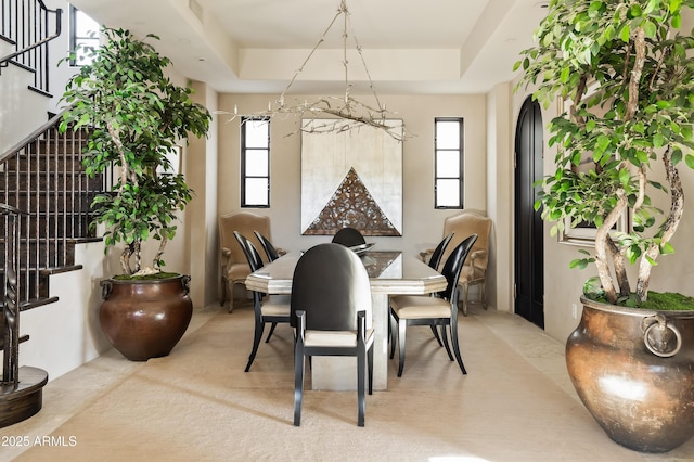 dining space with a tray ceiling